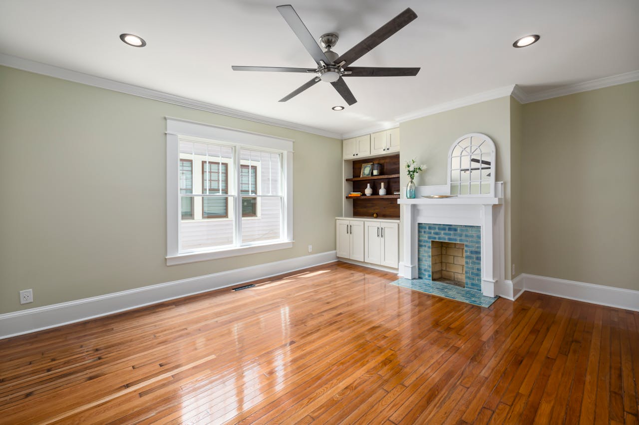 gallery-3 Spacious living room with hardwood floors and a contemporary fireplace.